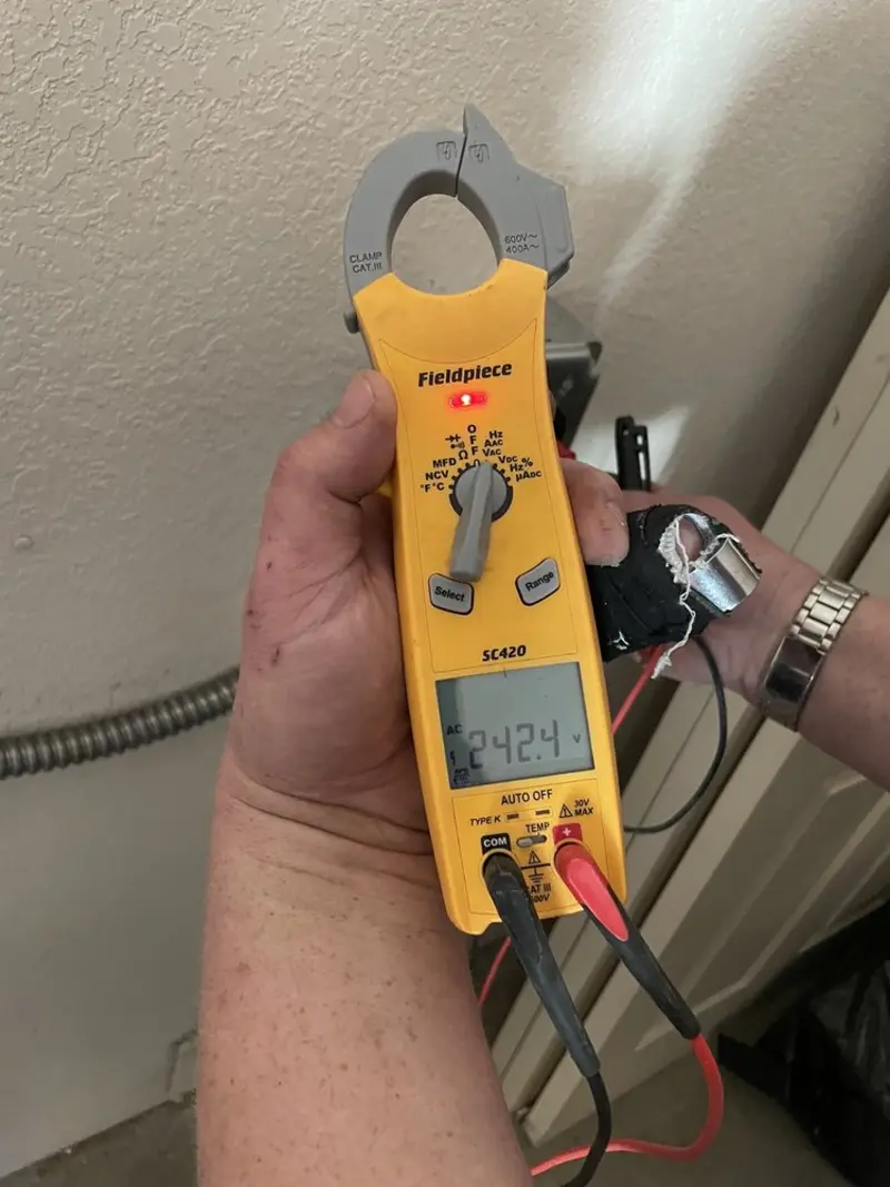 Voltage testing with clamp meter during Circuit Breaker Repair in Alliance